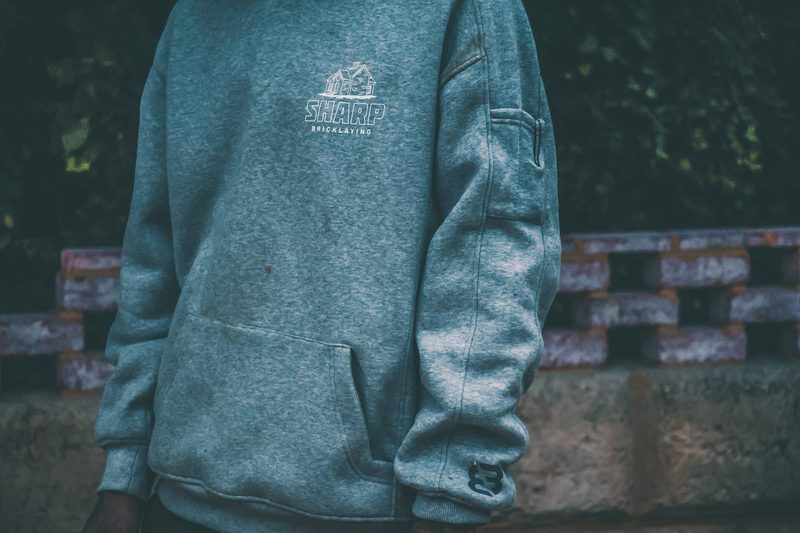 Front of a Sharp Bricklaying hoodie with the logo on the chest