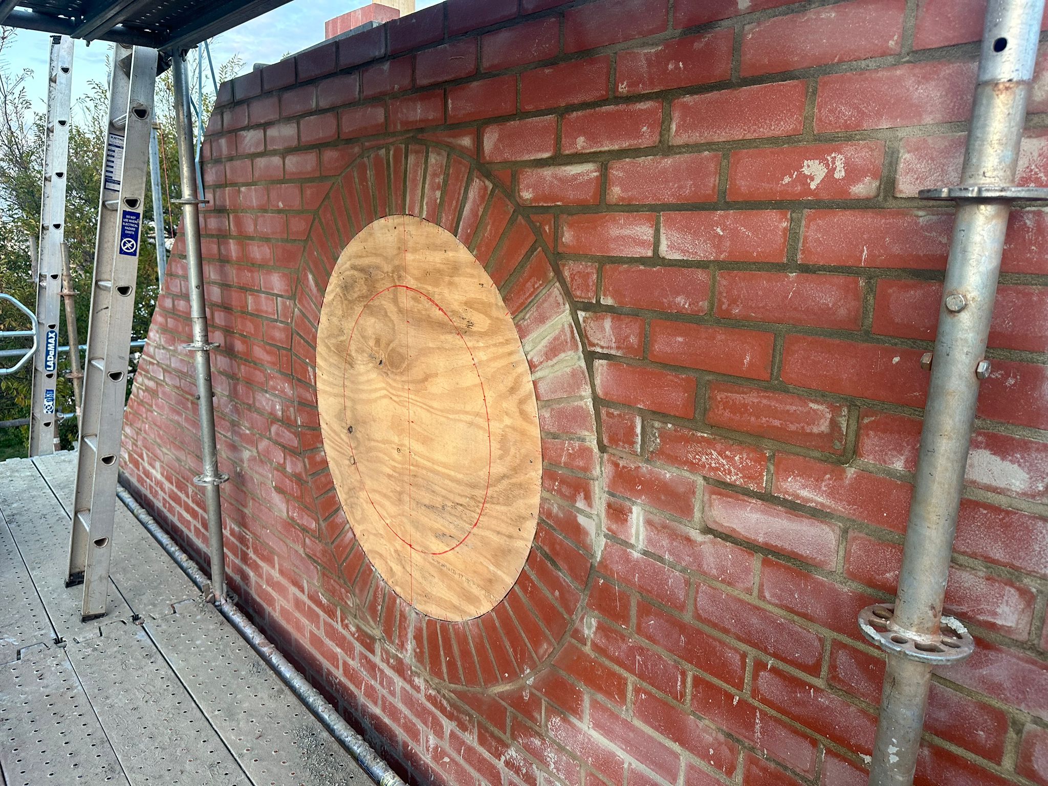 Custom circular window feature set out through the wall and gable, Cottesloe
