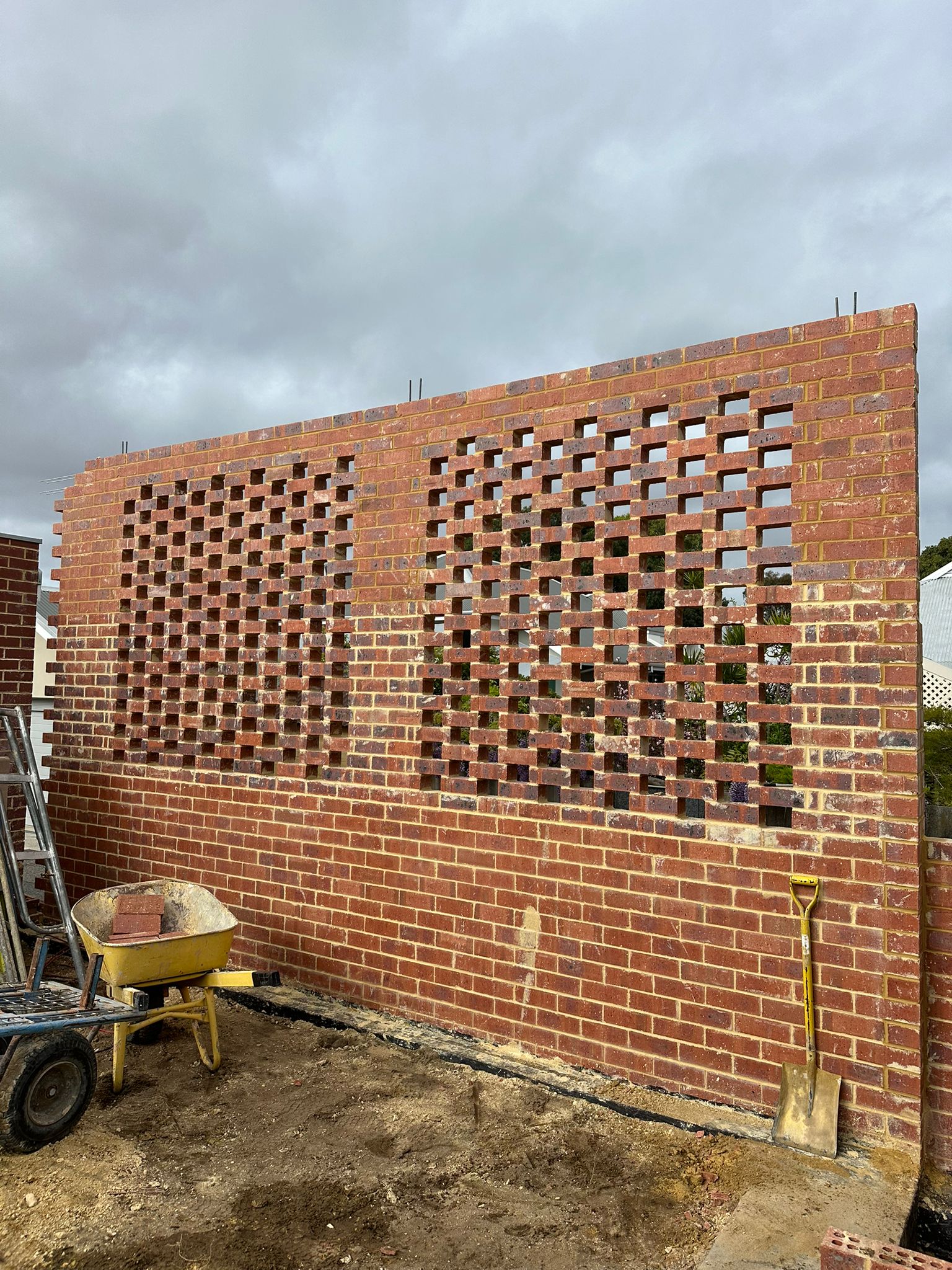 Boundary wall with hit-and-miss bond above eye level — Subiaco